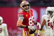 George Kittle of the San Francisco 49ers celebrates during an NFL football game against the Arizona Cardinals at State Farm Stadium on December 17,...